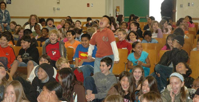 Magician makes students laugh and delivering positive messages