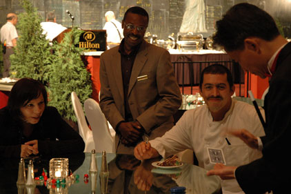 Employees of Hilton Hotel enjoy a holiday magic show