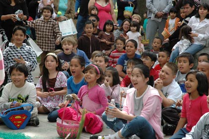 Children of all ages watch the Easter magic show
