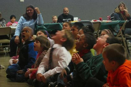 The boys and girls scream at a magic show in Apple Valley